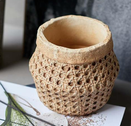 small rattan style planter