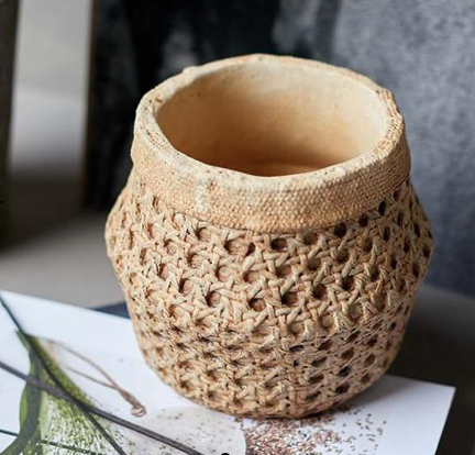 small rattan style planter 